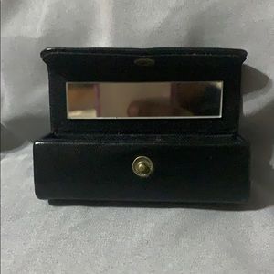 Black lipstick case with compact mirror